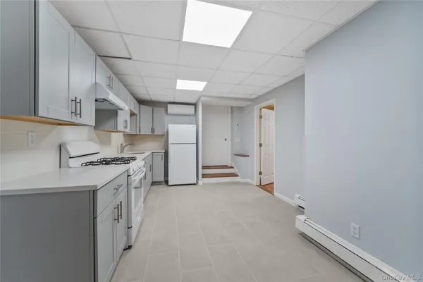 a kitchen with stainless steel appliances a refrigerator and a stove