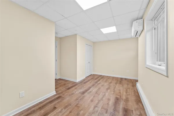 a view of hallway with wooden floor