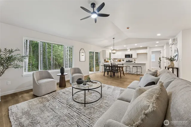 a living room with furniture and a large window