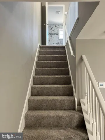 a bathroom with a granite countertop toilet sink and tub