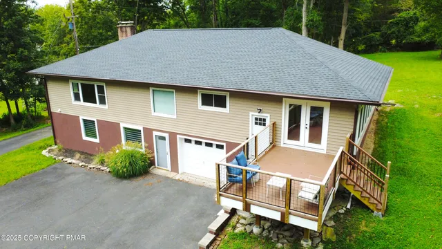 a backyard of a house with lots of green space