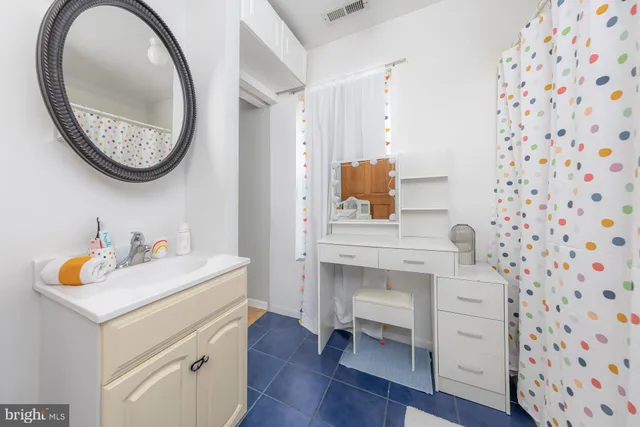 a utility room with sink dryer and washer