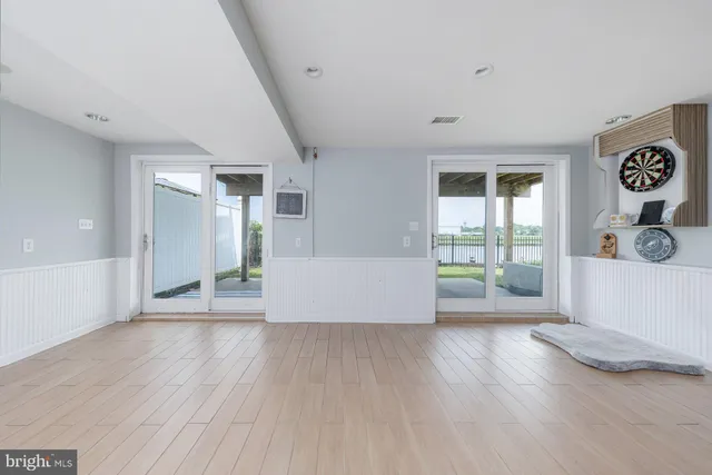 a view of an empty room and a window