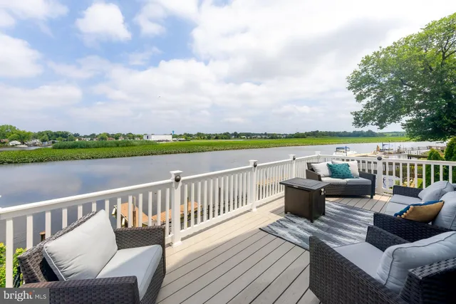 a view of a patio with couches chairs and a table