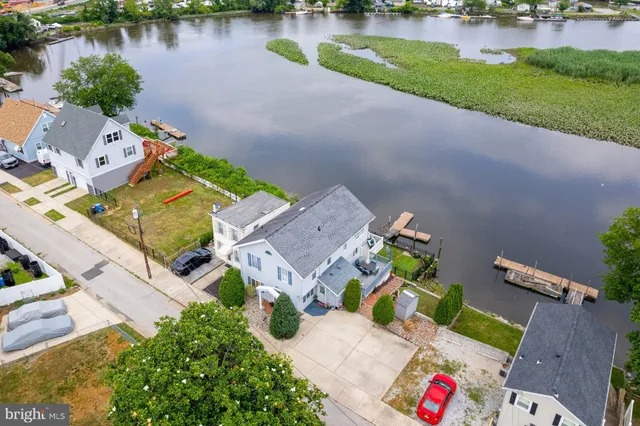 an aerial view of a house with a lake view