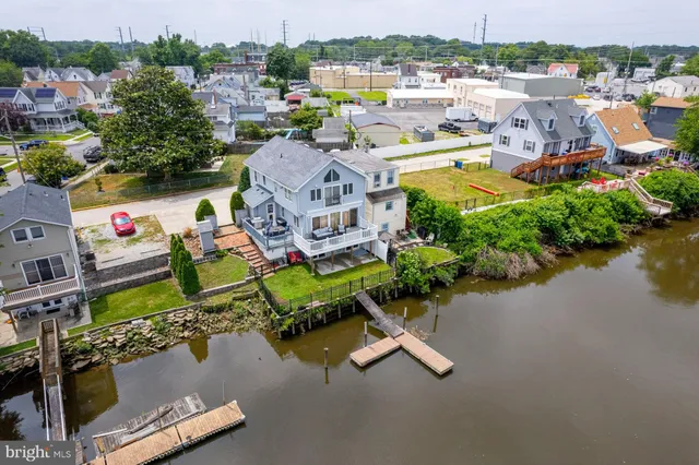 an aerial view of a house with yard swimming pool and outdoor seating