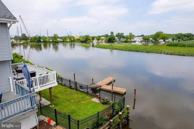 a view of swimming pool with outdoor seating