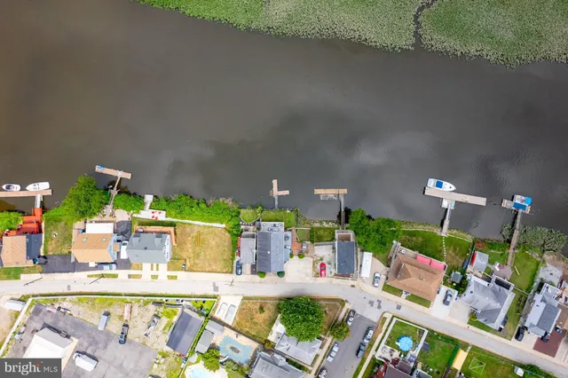 an aerial view of house with yard swimming pool and outdoor seating