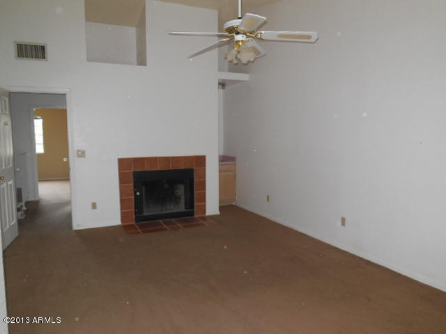 170 East Guadalupe Road, Unit 148 Gilbert, AZ 85234 - Photo 14 of 29 a view of empty room with a fireplace