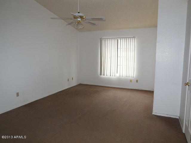170 East Guadalupe Road, Unit 148 Gilbert, AZ 85234 - Photo 15 of 29 an empty room with a window