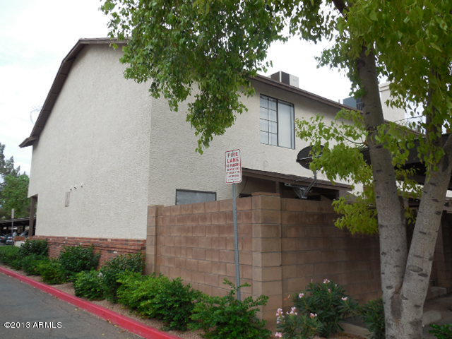 170 East Guadalupe Road, Unit 148 Gilbert, AZ 85234 - Photo 16 of 29 a backyard of a house with lots of green space