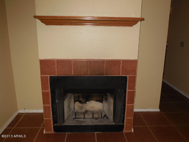 170 East Guadalupe Road, Unit 148 Gilbert, AZ 85234 - Photo 29 of 29 a room with a fireplace