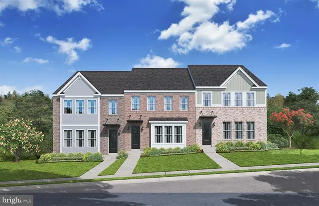 a view of residential houses with yard and green space