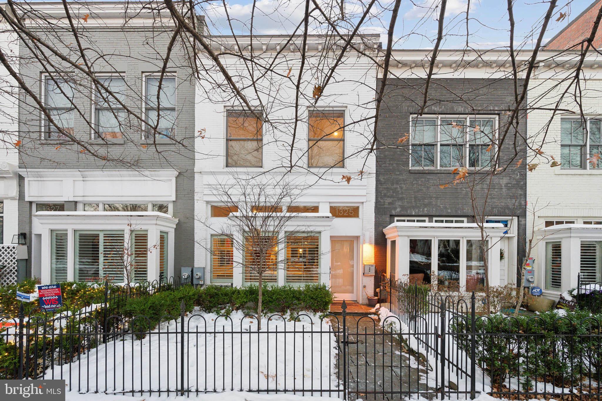 1325 Constitution Avenue Northeast Washington, DC 20002 - Photo 1 of 36 front view of a brick house with a large windows