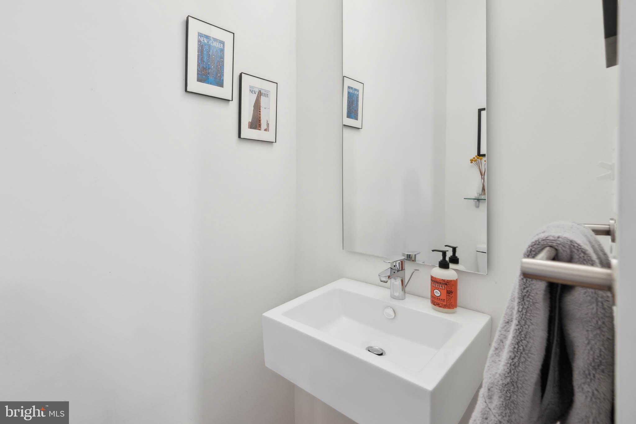 1325 Constitution Avenue Northeast Washington, DC 20002 - Photo 15 of 36 a bathroom with a sink and a mirror