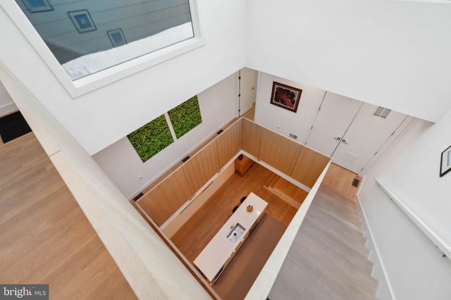 a spacious bedroom with a large bed and a large window with outer view