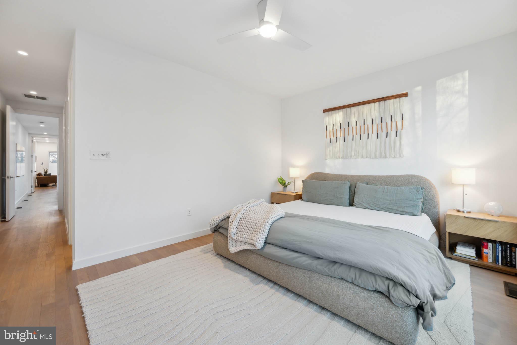 1325 Constitution Avenue Northeast Washington, DC 20002 - Photo 18 of 36 a bedroom with a bed and a view of bathroom