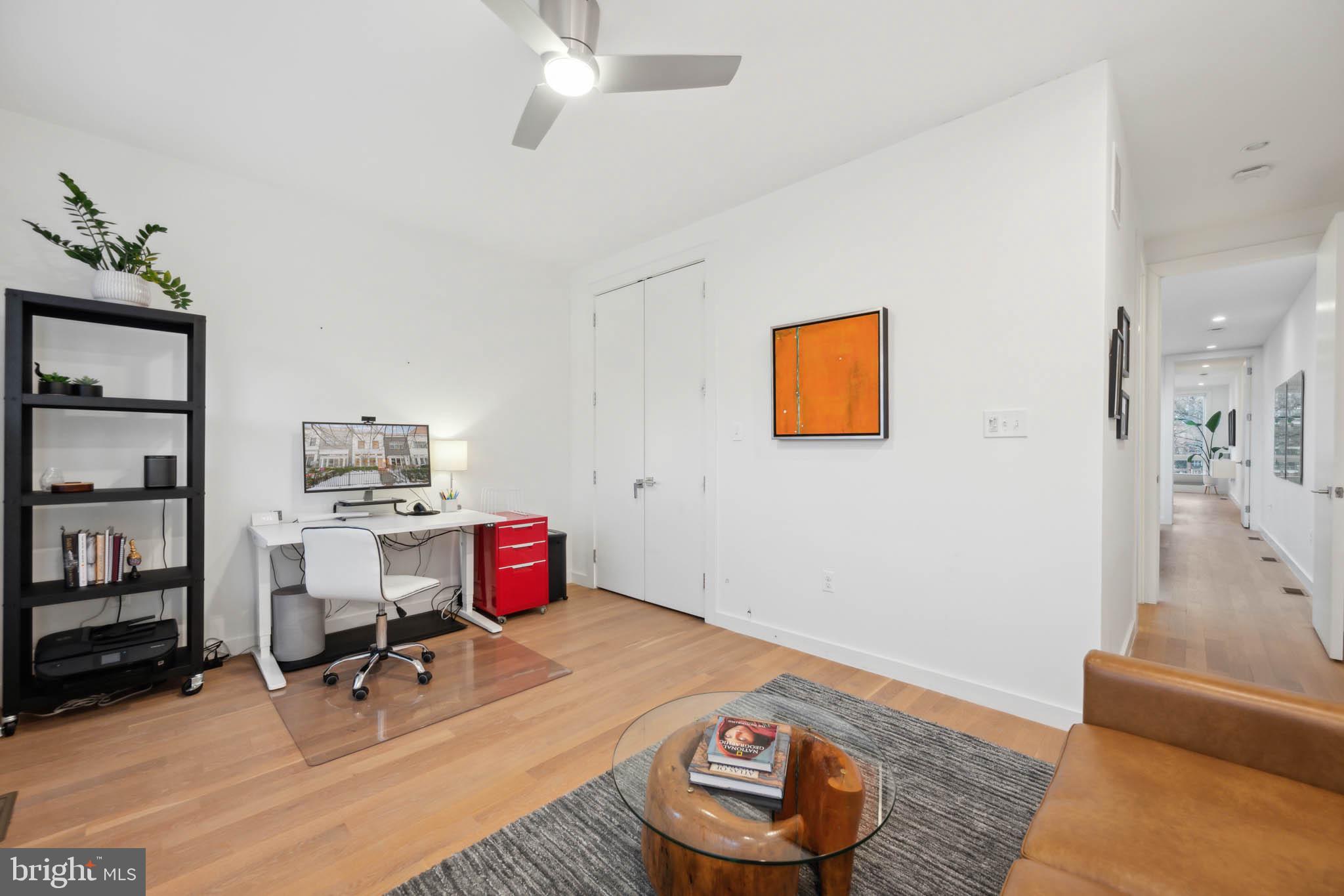1325 Constitution Avenue Northeast Washington, DC 20002 - Photo 22 of 36 a room with furniture and wooden floor