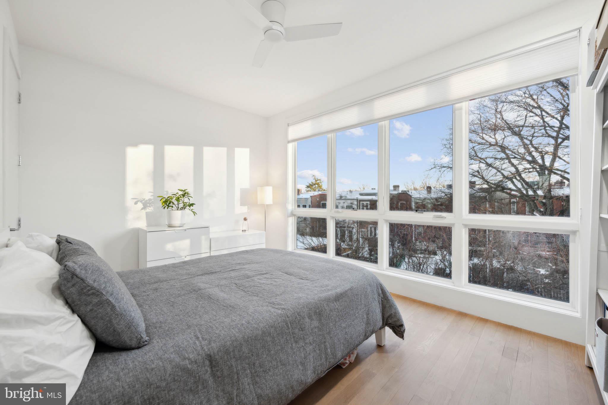 1325 Constitution Avenue Northeast Washington, DC 20002 - Photo 26 of 36 a spacious bedroom with a large bed and a window