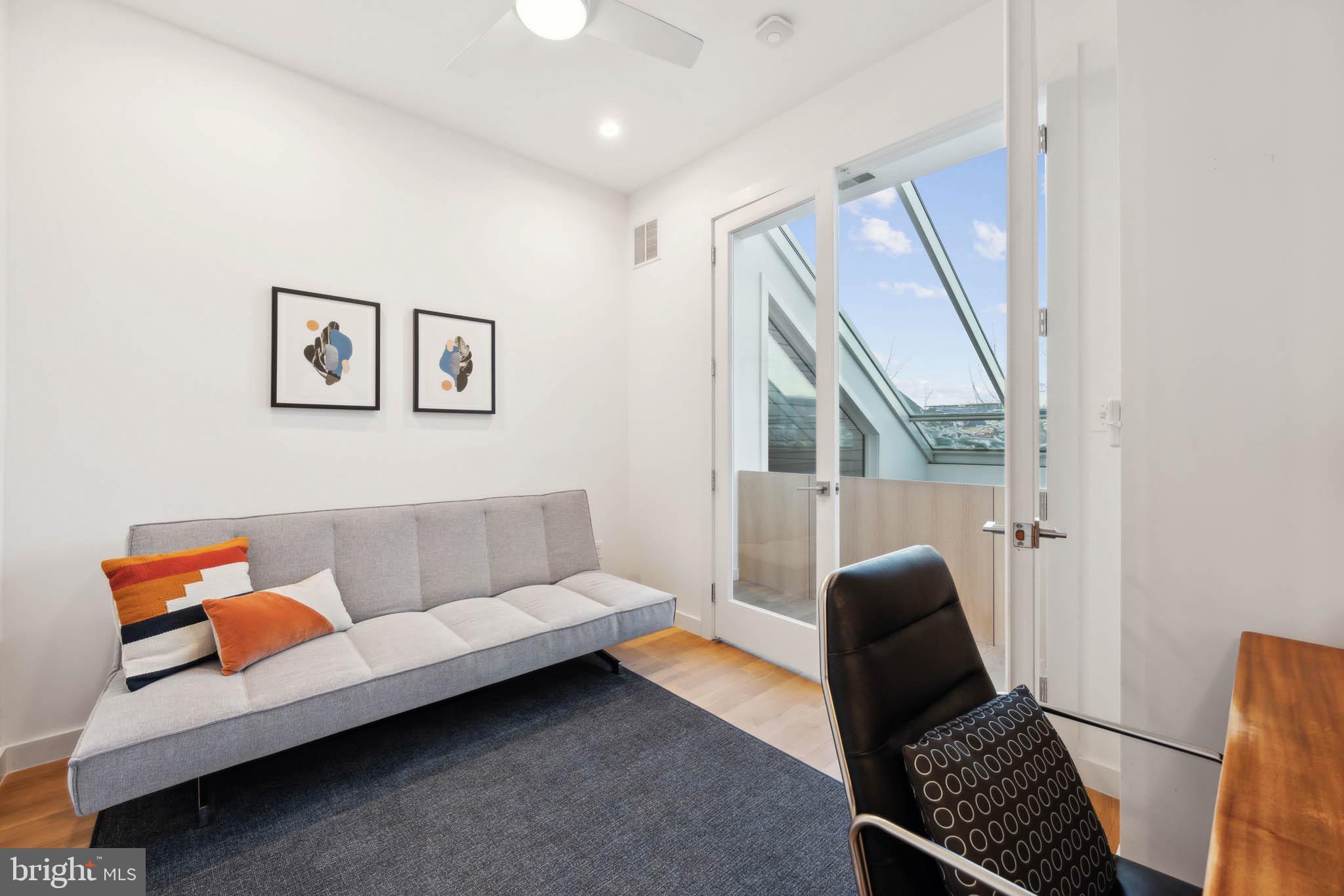 1325 Constitution Avenue Northeast Washington, DC 20002 - Photo 30 of 36 a living room with furniture and a window