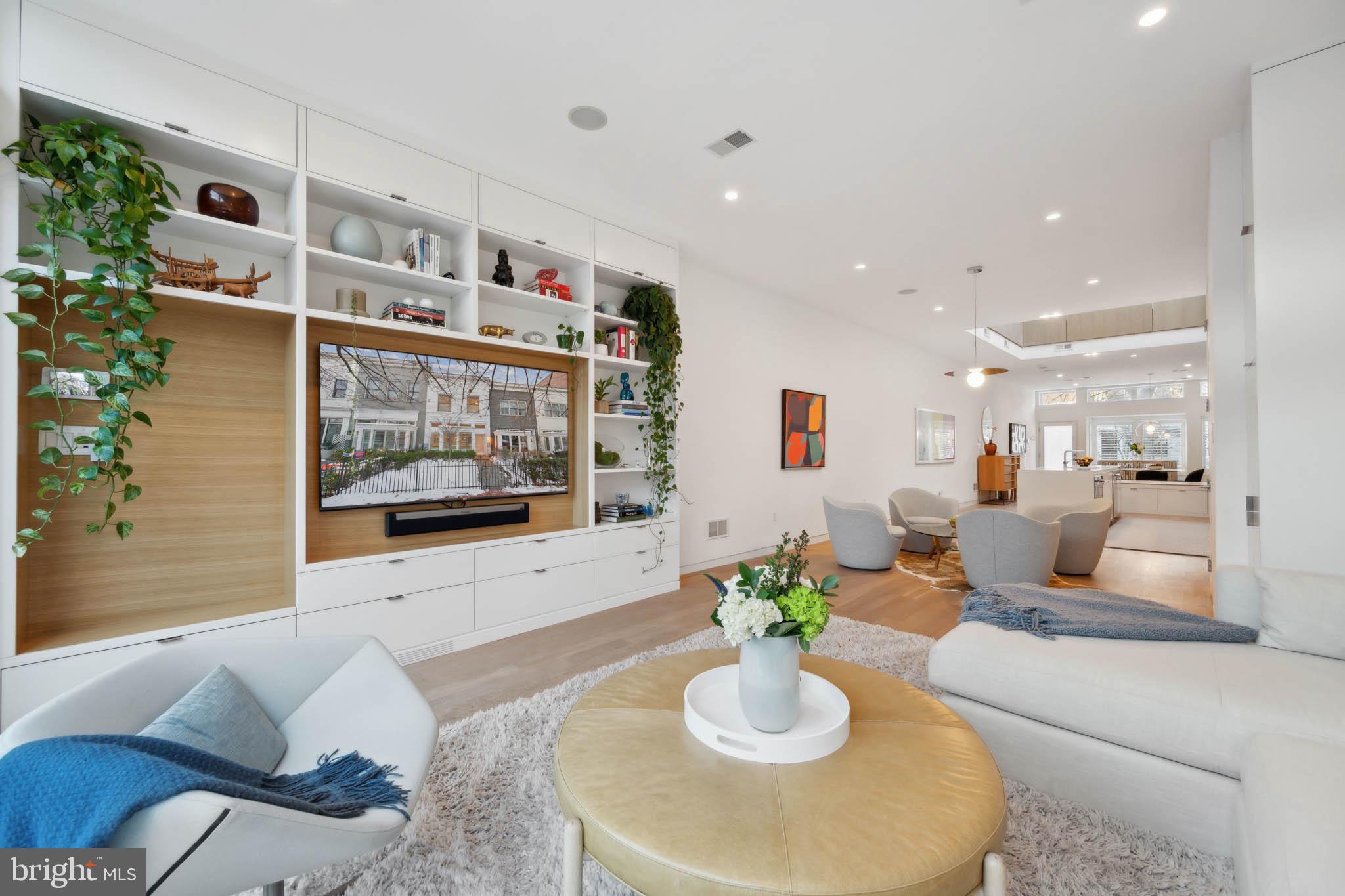 1325 Constitution Avenue Northeast Washington, DC 20002 - Photo 4 of 36 a living room with furniture and painting on the wall