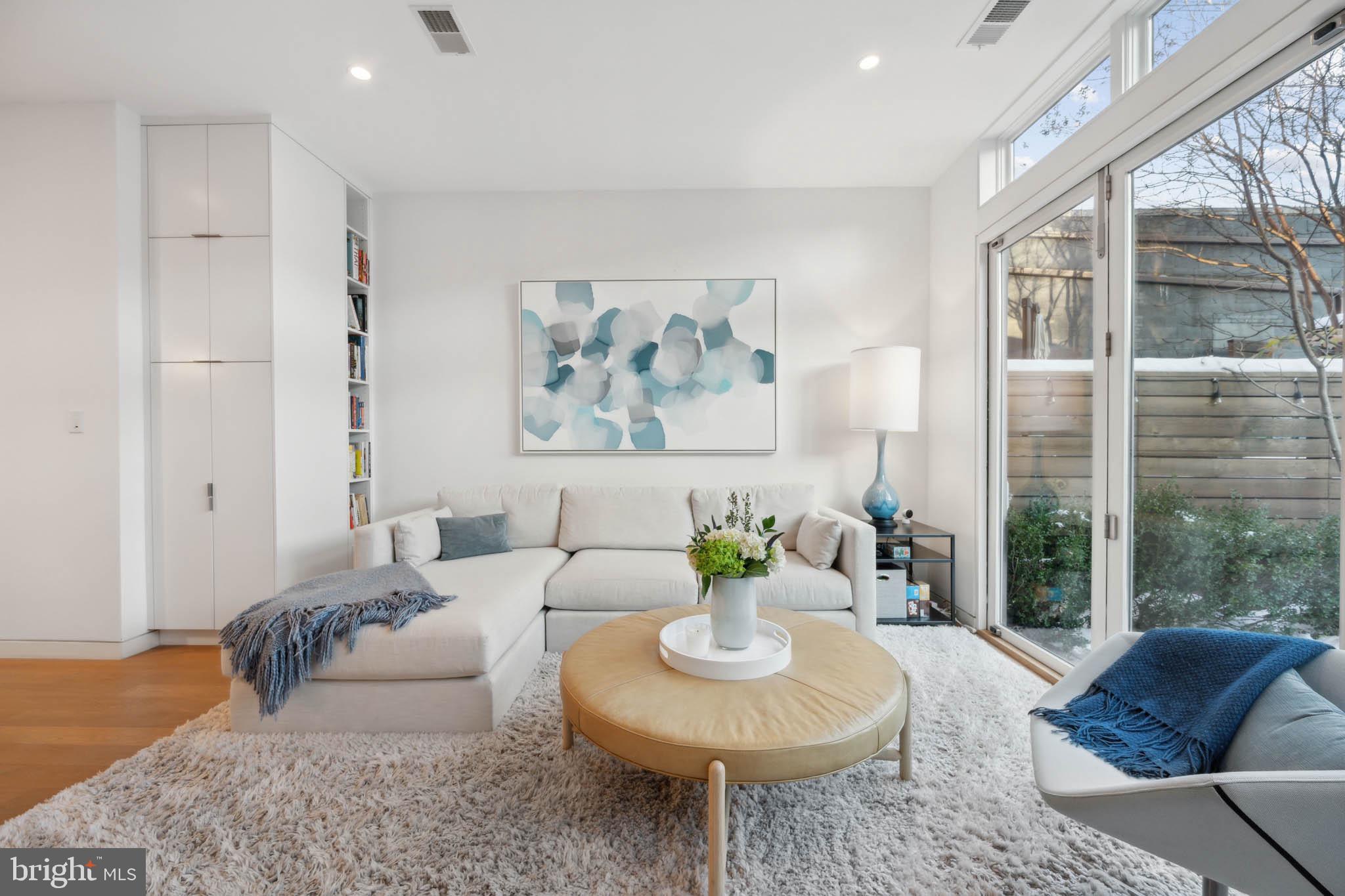 1325 Constitution Avenue Northeast Washington, DC 20002 - Photo 6 of 36 a living room with furniture and a large window