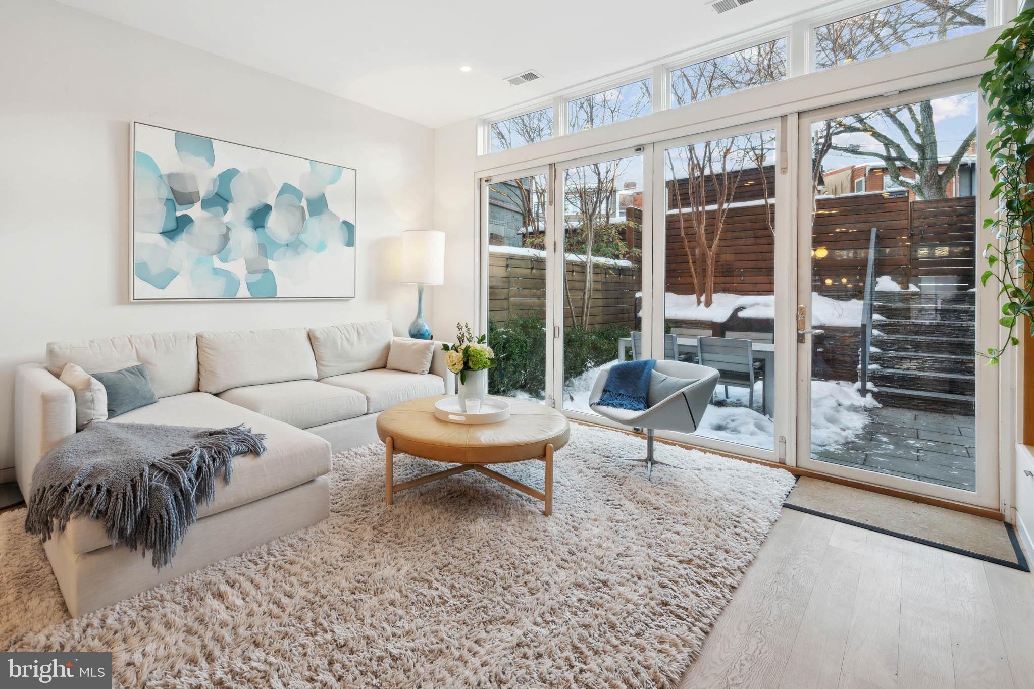 1325 Constitution Avenue Northeast Washington, DC 20002 - Photo 7 of 36 a living room with furniture and a large window