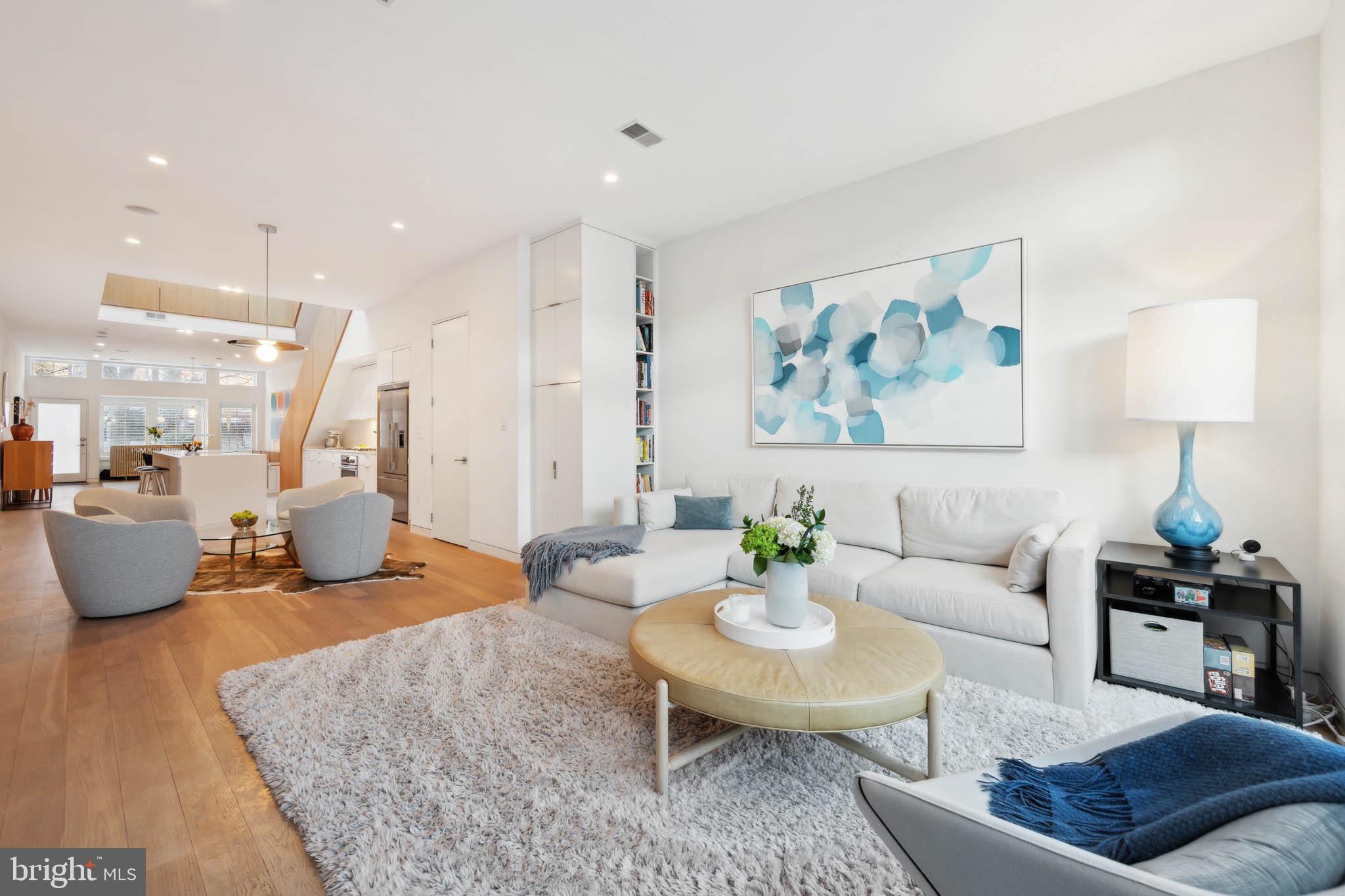 1325 Constitution Avenue Northeast Washington, DC 20002 - Photo 8 of 36 a living room with furniture and a lamp