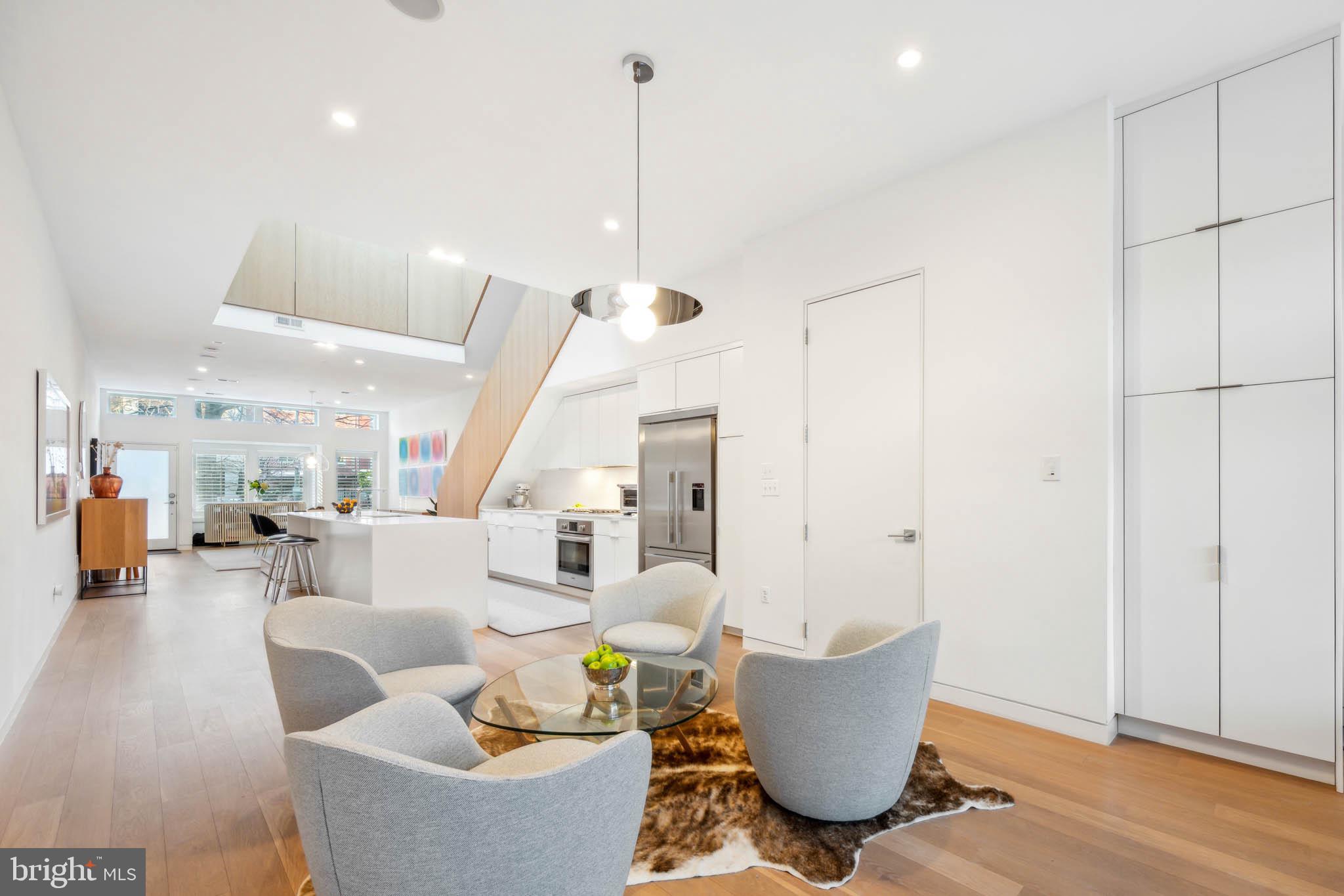 1325 Constitution Avenue Northeast Washington, DC 20002 - Photo 9 of 36 a living room with furniture and a wooden floor
