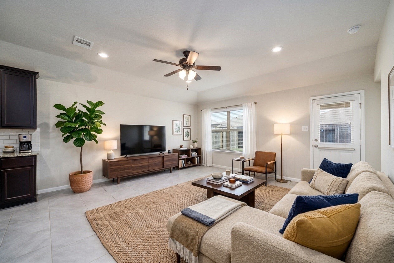 8307 Oakleaf Meadow Court Rosharon, TX 77583 - Photo 7 of 39 a living room with furniture and a flat screen tv
