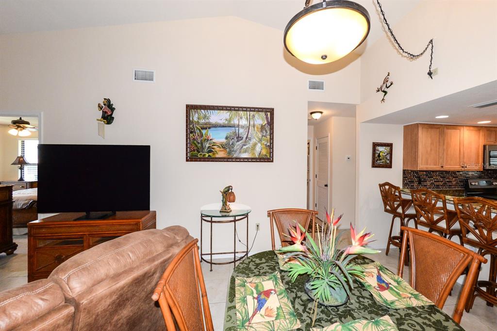 335 Coldeway Drive, Unit F21 Punta Gorda, FL 33950 - Photo 9 of 45 a living room with furniture and a flat screen tv