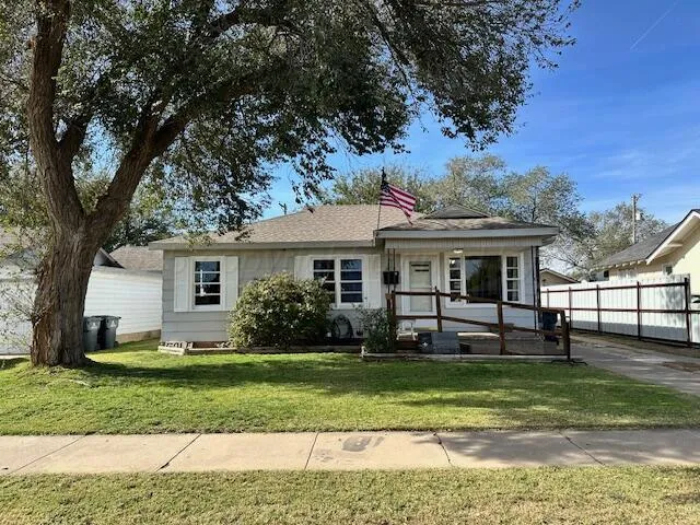 a view of a house with a yard porch and sitting area
