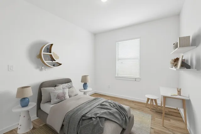 a bedroom with a bed and window