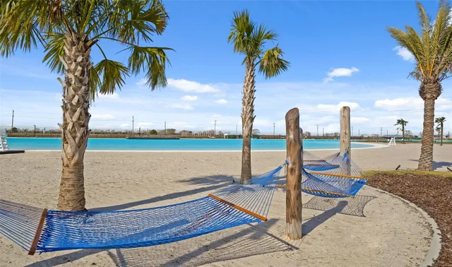 a view of swimming pool with outdoor seating and yard