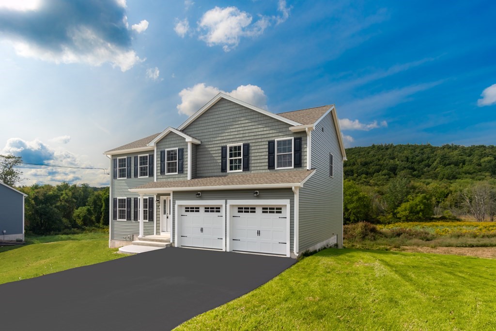 4 Upper Palmer Road Monson, MA 01057 - Photo 2 of 42 a front view of a house with a yard