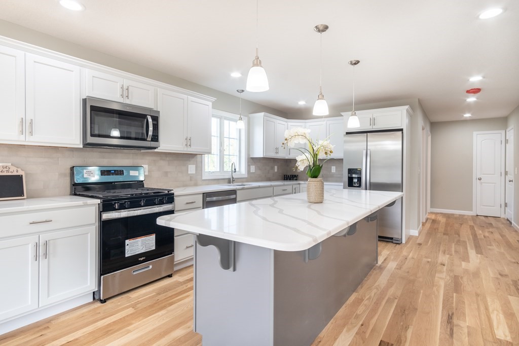 4 Upper Palmer Road Monson, MA 01057 - Photo 7 of 42 a kitchen with stainless steel appliances granite countertop a sink stove and refrigerator