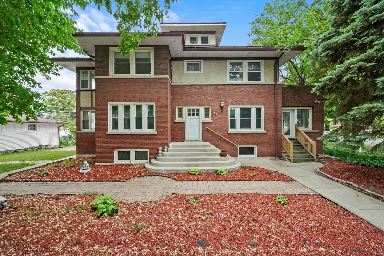 6822 34th Street Berwyn, IL 60402 - Photo 1 of 35 a front view of a house with a yard