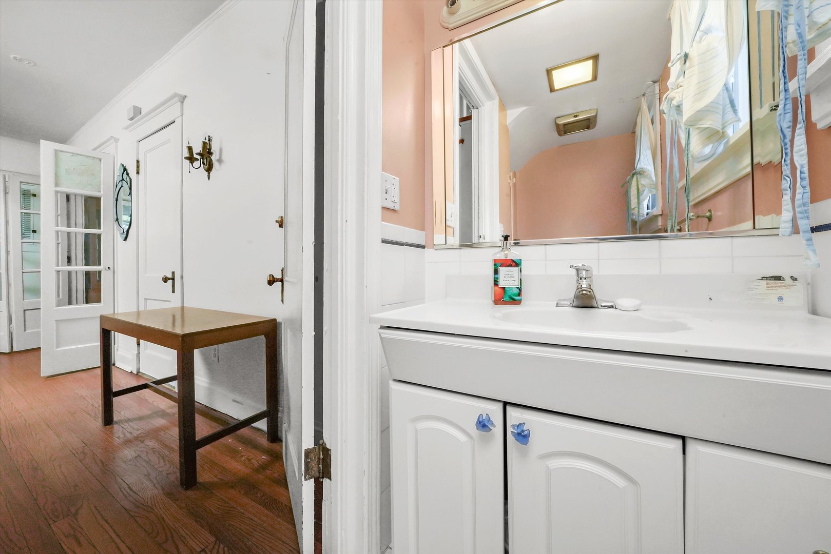6822 34th Street Berwyn, IL 60402 - Photo 13 of 35 a bathroom with a sink and a mirror