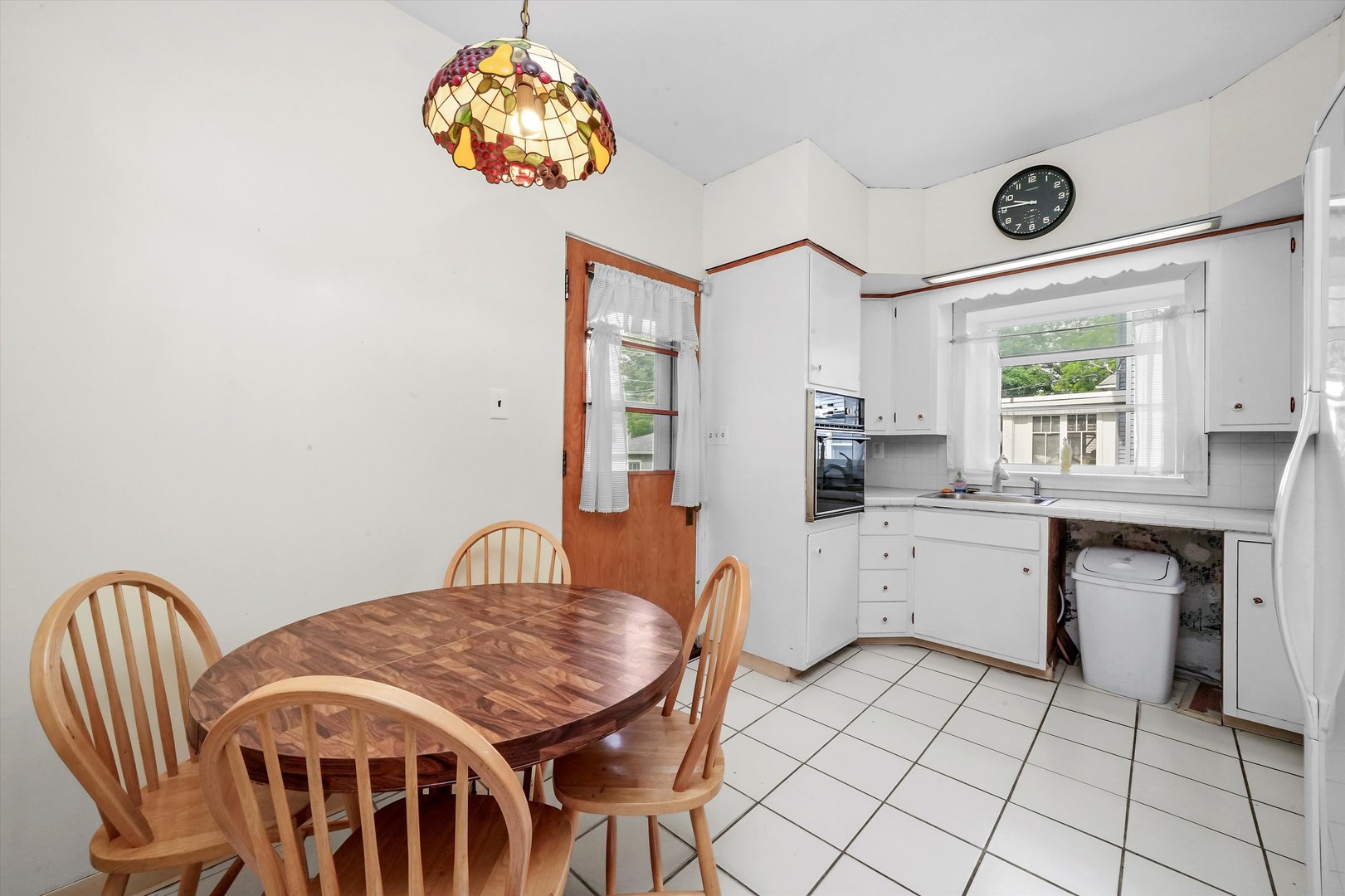 6822 34th Street Berwyn, IL 60402 - Photo 14 of 35 a kitchen with stainless steel appliances granite countertop a stove a sink dishwasher and a microwave