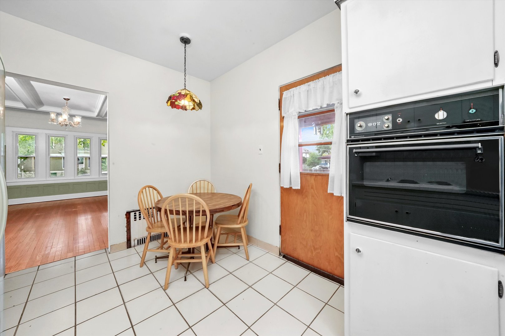 6822 34th Street Berwyn, IL 60402 - Photo 17 of 35 a dining room with furniture and wooden floor