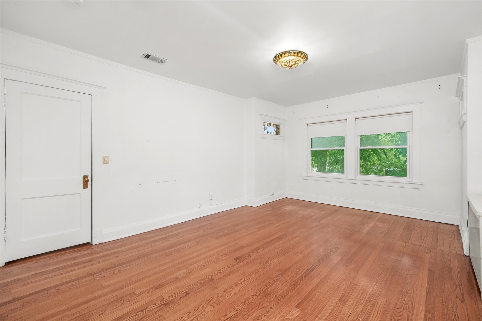 6822 34th Street Berwyn, IL 60402 - Photo 21 of 35 wooden floor in an empty room with a window