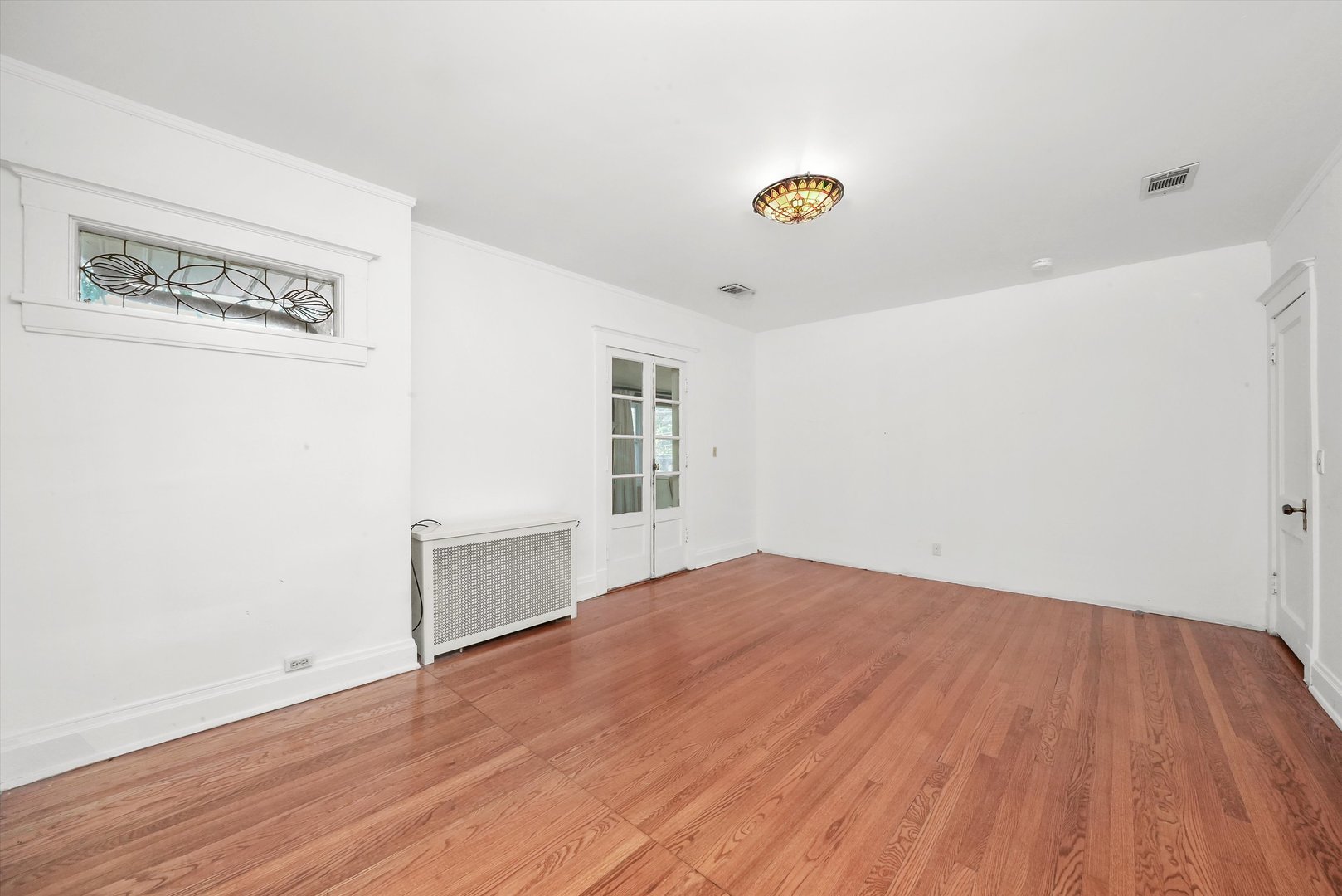 6822 34th Street Berwyn, IL 60402 - Photo 22 of 35 a view of empty room with wooden floor