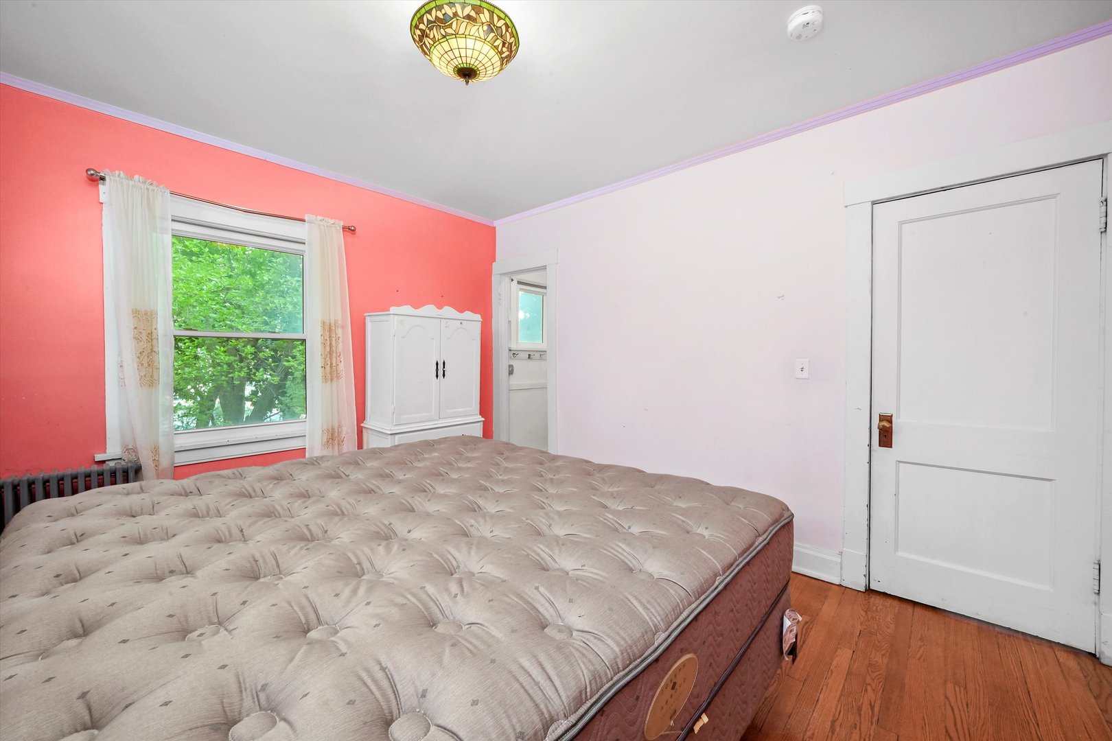 6822 34th Street Berwyn, IL 60402 - Photo 25 of 35 a bedroom with a bed and a window