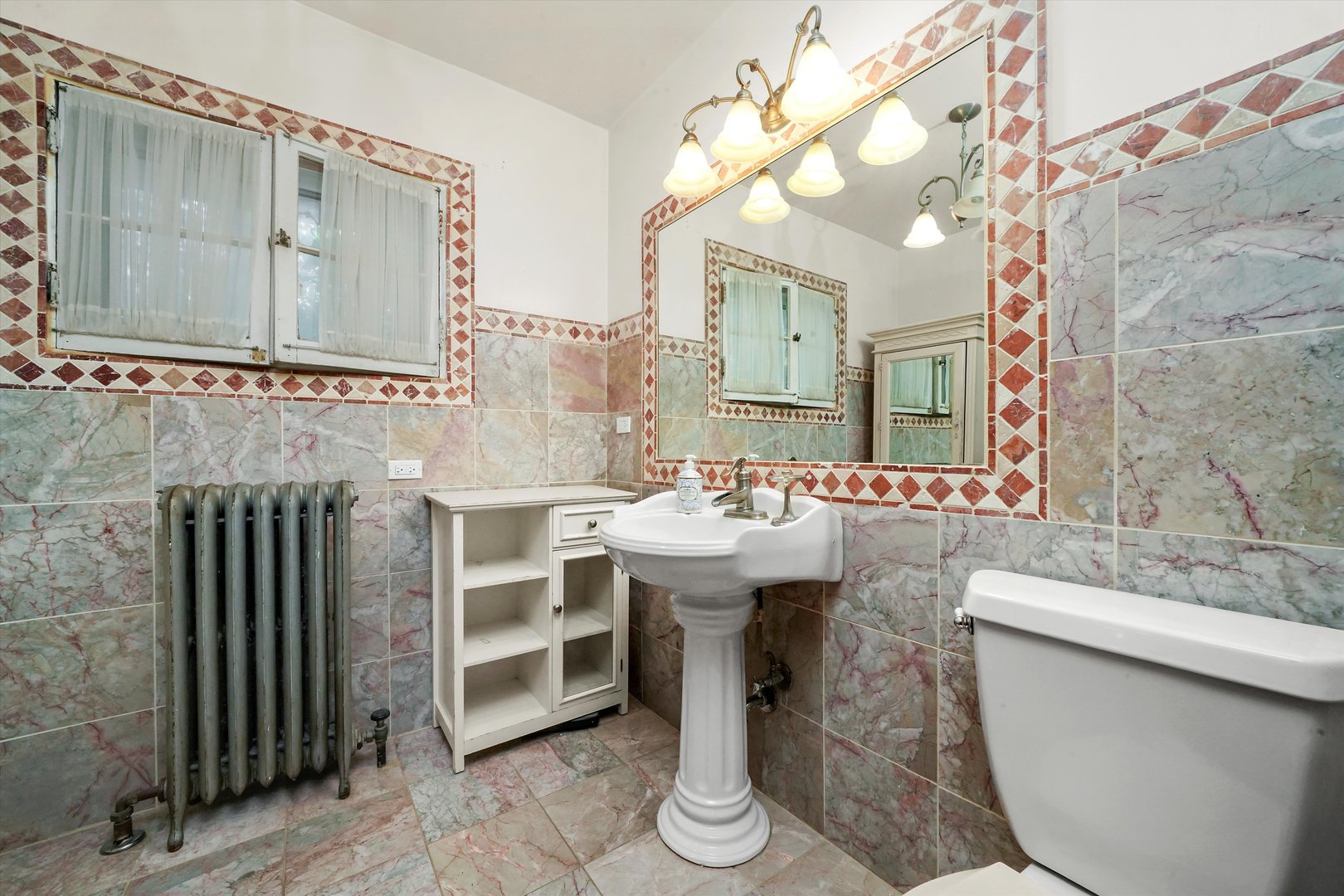 6822 34th Street Berwyn, IL 60402 - Photo 28 of 35 a bathroom with a sink and a mirror