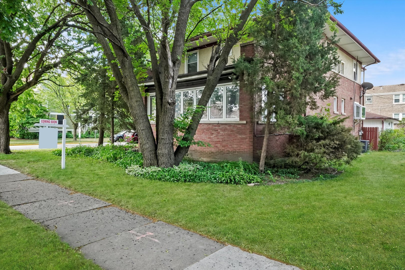 6822 34th Street Berwyn, IL 60402 - Photo 3 of 35 a front view of a house with a garden