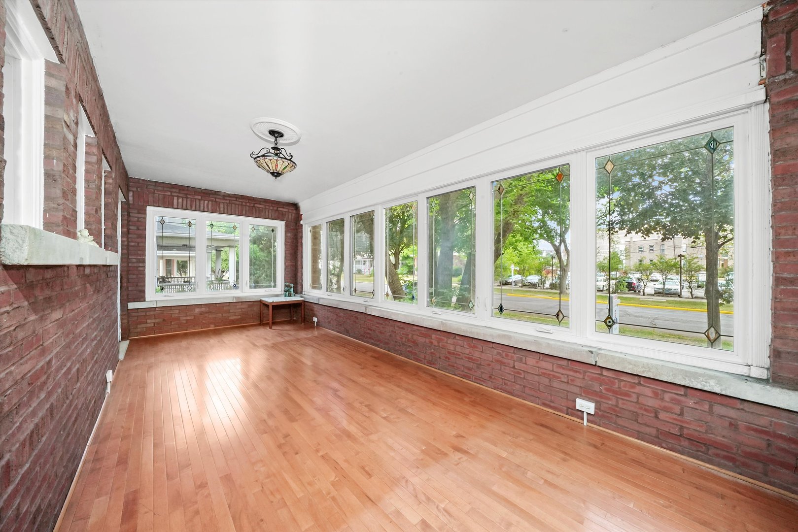 6822 34th Street Berwyn, IL 60402 - Photo 5 of 35 a view of an empty room with wooden floor and a window