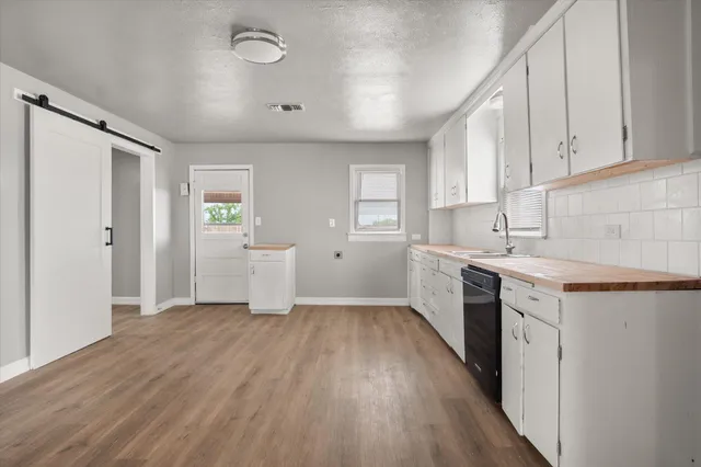 a view of a kitchen with electric appliances