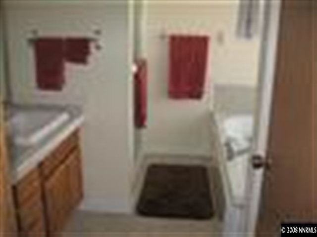 15050 North Red Rock Road Reno, NV 89508 - Photo 5 of 9 a bathroom with a sink and mirror