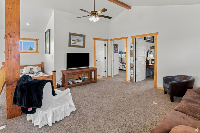 715 Ranch Loop Road Preston, ID 83263 - Photo 33 of 77 Carpeted loft area featuring vaulted ceilings with exposed wood beams