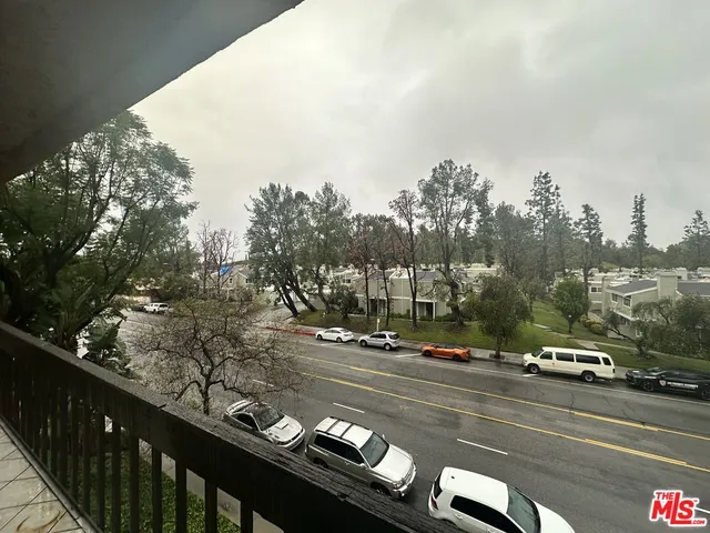 a view of a city street with cars